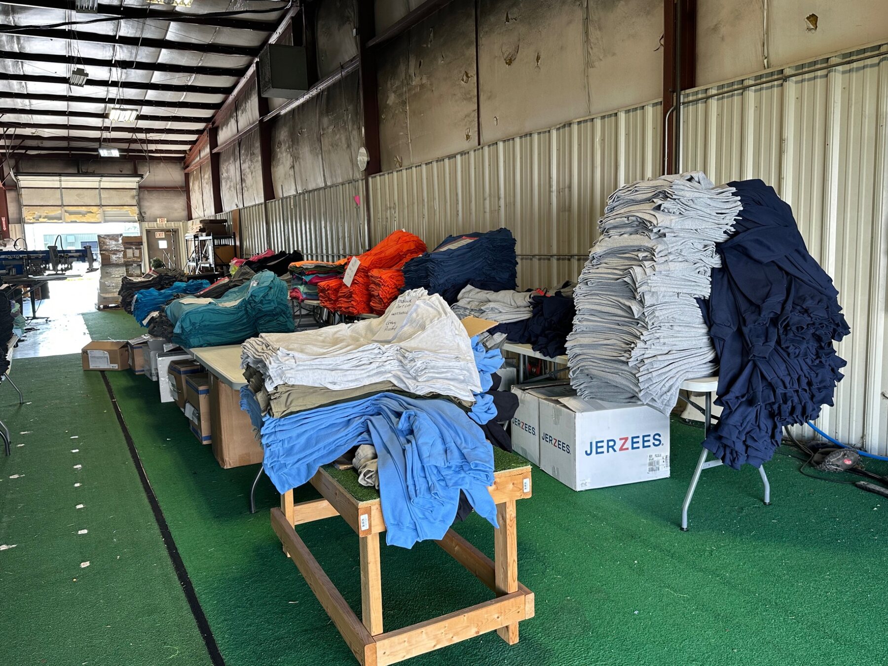 Apparel organized in stacks at the NAS facility for production and fulfillment